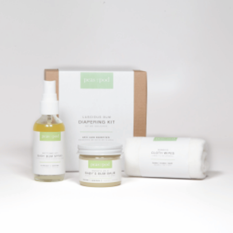 Image showcasing organic and handcrafted diapering essentials in a kit, featuring 'All Things Jill' Smooth as a Baby's Bum Balm, 'All Things Jill' Bottoms Up! Baby Bum Spray, and 'All Things Jill' Bamboo Cloth Wipes.