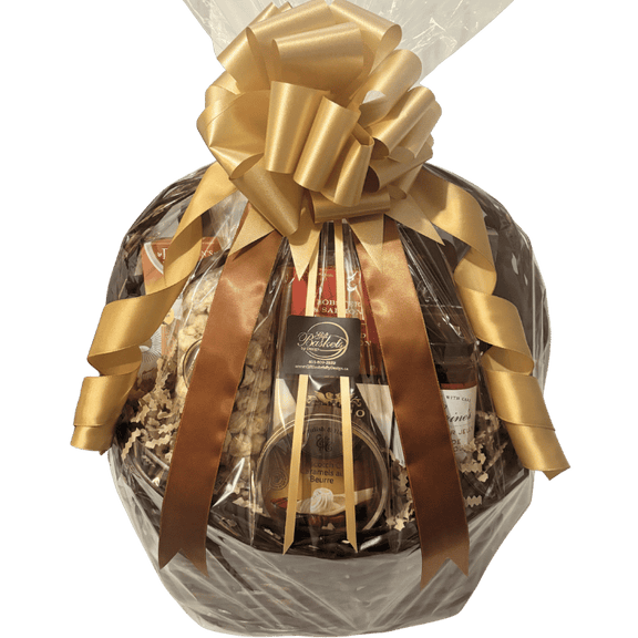 Luxury gourmet gift basket featuring artisan Canadian cheeses, smoked salmon pâté, handcrafted chocolates, gourmet crackers, specialty coffee, premium tea, popcorn, preserves, and entertaining favourites, beautifully presented for local Calgary gift delivery.