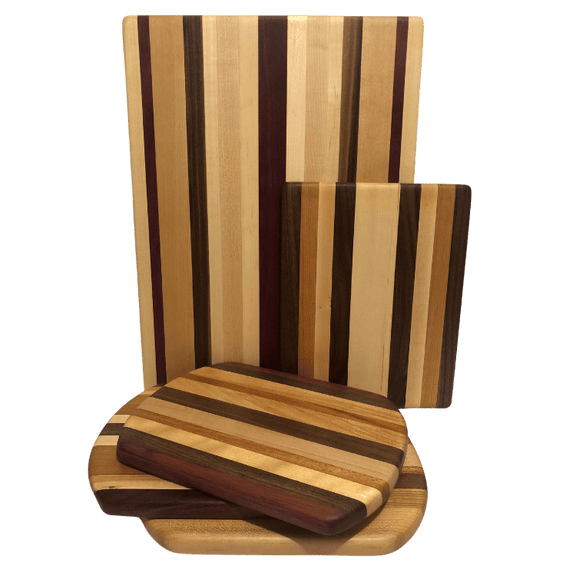 Handcrafted cheese and charcuterie boards made from reclaimed wood, featuring a striped pattern with different wood tones.