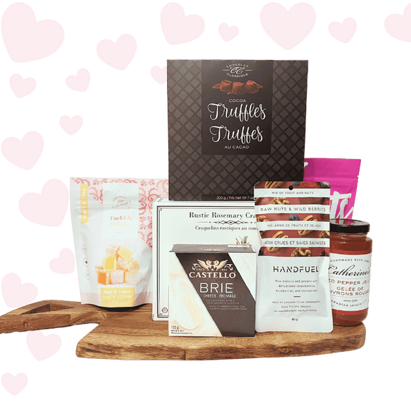 Love at First Bite Valentine’s charcuterie gift basket with gourmet crackers, brie cheese, chocolates, salmon, and sweet treats, beautifully packaged for Valentine’s Day