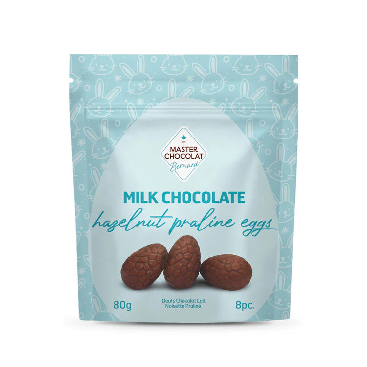 Milk chocolate hazelnut praline Easter eggs by Master Chocolat, featuring creamy hazelnut filling and spring-themed packaging.