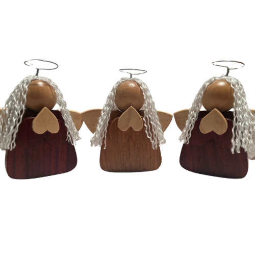 Handcrafted wooden angel figure made in Calgary, carved with natural wood grains, standing upright as a keepsake