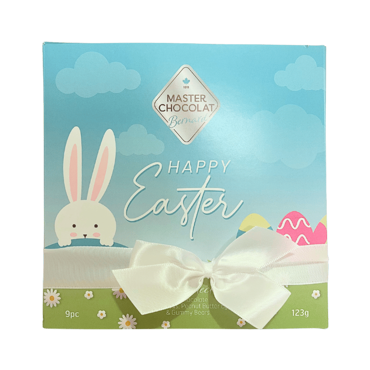 Blue Easter chocolate box featuring a cheerful bunny illustration and “Happy Easter” text, filled with assorted gourmet chocolates by Master Chocolat.